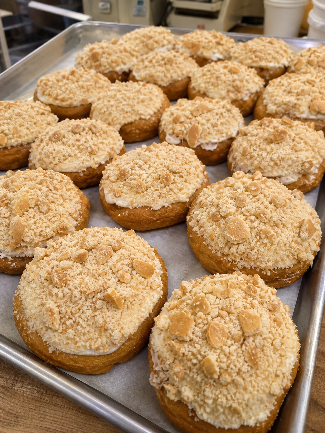 Trays of crumb-topped Bailey Jayne's donuts