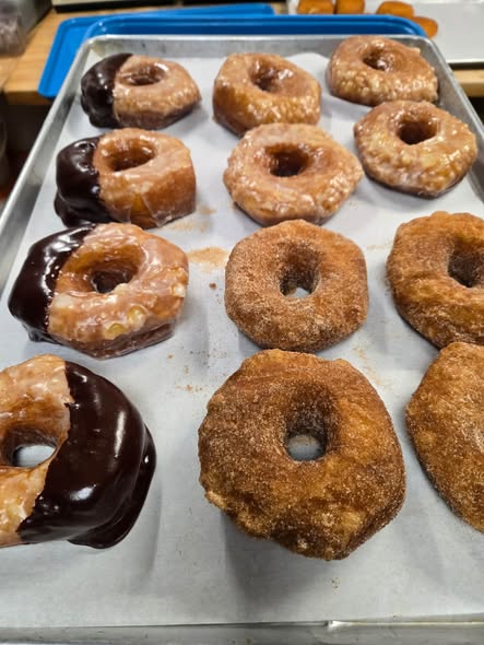 Glazed, chocolate-dipped, and cinnamon donuts