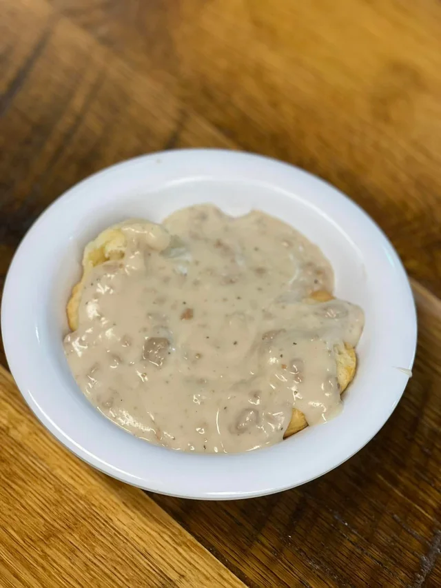 Buttermilk biscuits covered in sausage gravy.